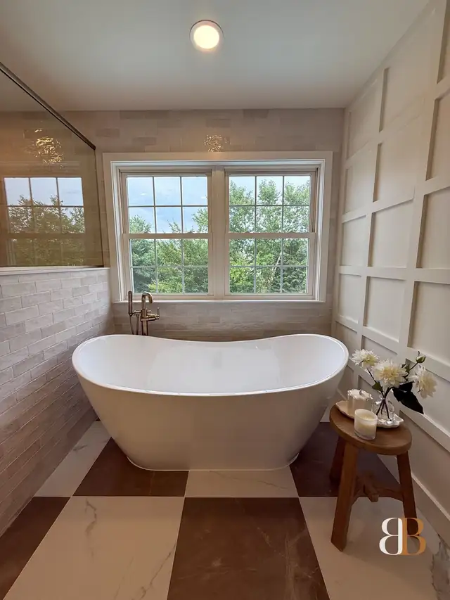 Pipersville master bath with a freestanding tub under a double window, a black and white checkerboard tile floor and white board-and-batten wainscoting